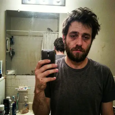 Analyst bathroom selfie before AI enhanced dating photo